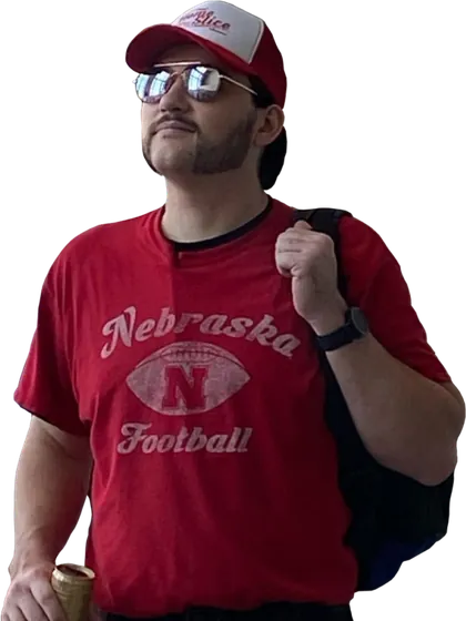 Joe in a red Nebraska Football shirt and cap